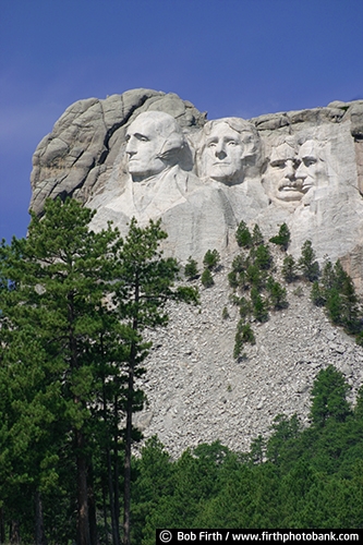 Mount Rushmore National Memorial;American Presidents;Americana;Black Hills;destination;Gutzon Borglum;granite face;landmark;Mt Rushmore;national symbol;patriotic;rock carvings of Presidents;sculpture;SD;South Dakota;symbol;tourism;monument;statue;trees;Abraham Lincoln;George Washington;Theodore Roosevelt;Thomas Jefferson;pines