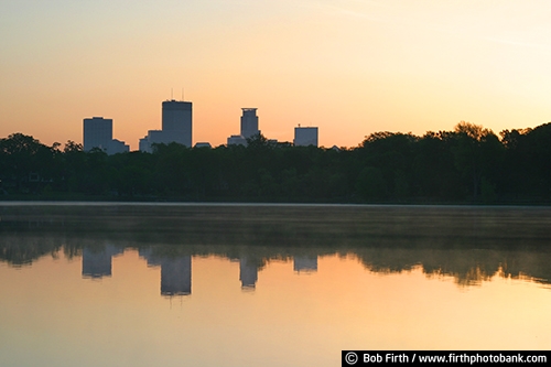 Twin Cities;trees;tourism;destination;sunrise;summer;skylines;silhouettes;Mpls;MN;Minnesota;Minneapolis;Lake of the Isles;lakes;park;reflections;water