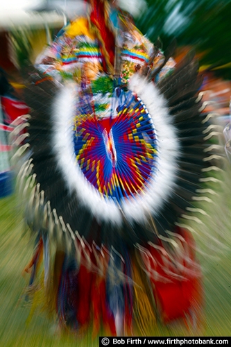 Native Americans;Native American Indians;Pow Wow;cultural;culture;dancer;Indian dancers;dancing;powwaw;social gathering;regalia;authentic design;customs;tradition;traditional;traditional ceremonies;Wacipi;American Indian gathering;celebration of life;tribes;dancing motion;feathers;colorful feathers;feathers used by Indians;feathers used in regalia;man;Native American clothing;feather bustle;eagle feathers used on Native American regalia;eagle feathers;eagle feather;Native American beadwork;colorful beads;beadwork;beads