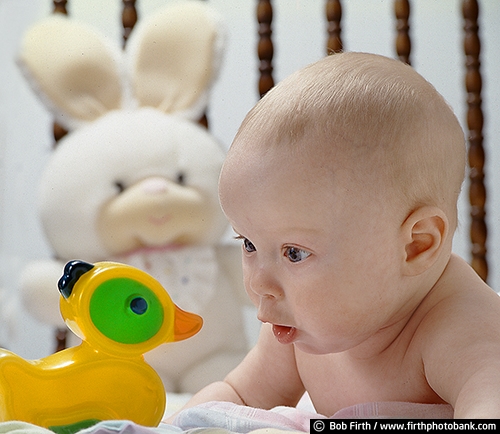 baby;boy;bunny;child;duck;crib;infant;playing;toys;stuffed animal;adorable