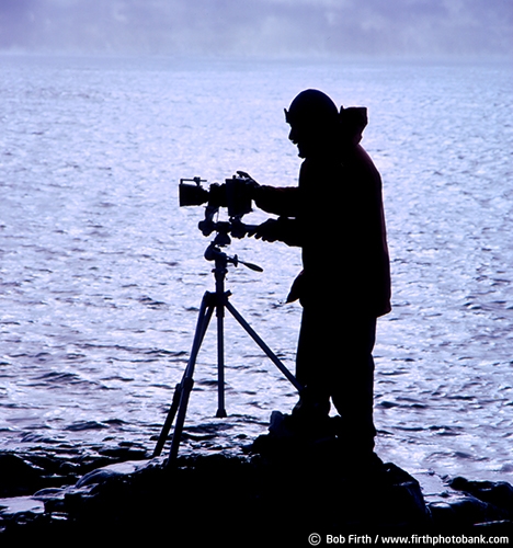 photographer;North Shore;MN;Minnesota;winter;solitude;silhoutte;male;man;Lake Superior;camera;tripod;below freezing;biggest fresh water lake;destination;frigid;Great Lakes;Kitchi Gammi;northern Minnesota;people;Bob Firth;largest freshwater lake;shoreline;taking photos