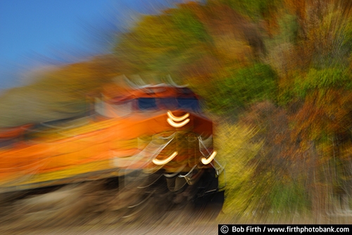Railroad;blur;motion;abstract;autumn;fall color;locomotive;train;transportation;engine;train engine;trees