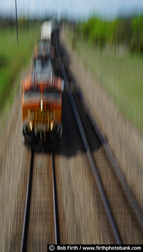 Railroad;industry;blur;engine;locomotive;motion;railroad tracks;shipping;tracks;train tracks;train;train engine;transportation;train in motion;railcars