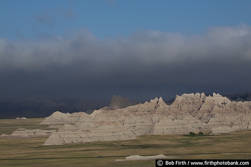 Badlands National Park SD;tourism;southwestern South Dakota;solitude;destination;erosion;rugged;geologic deposits;mixed grass prairie;sharply eroded buttes;approaching storm