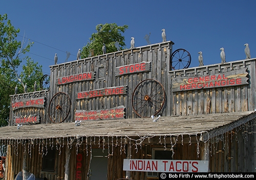 tourism;sign;signage;southwestern South Dakota;advertising;buildings;business;Badlands;country;food;historic;restaurant;western;business sign;rural;saloon;SD;store ;storefront;wagon wheel