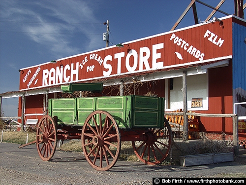 tourism;sign;signage;southwestern South Dakota;advertising;buildings;business;Badlands;country;food;historic;western;business sign;rural;store ;storefront;wagon wheel;wagon