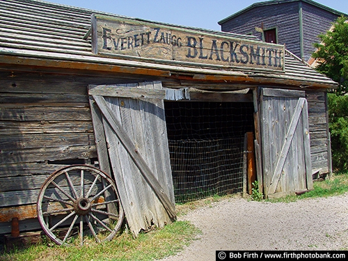 1880 Ghost Town;Midland SD;old building;South Dakota;weathering;weathered;tourism;country;destination;rural;blacksmith shop;advertising;business sign;store ;wagon wheel