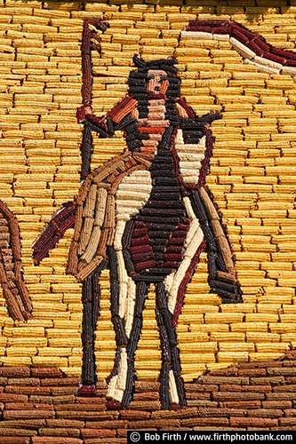 Mitchell Corn Palace;mural;landmark;SD;South Dakota;signage;historic;details;decorated in corn;corncob art;corn and grain designs;building exterior;destination;tourism;close up;horseback riding