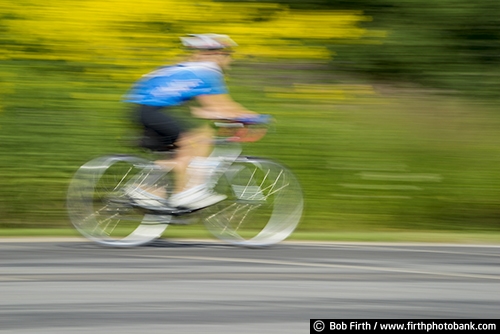 Bicycling;action shot;bicycle;bike;biker;biking;blur;Carver County MN;Carver Park Reserve;cycling;cyclist;exercise;fast;Minnesota;MN;motion;pedaling;recreation;recreational;road bike;solo;Three Rivers Park District;Victoria MN;woman