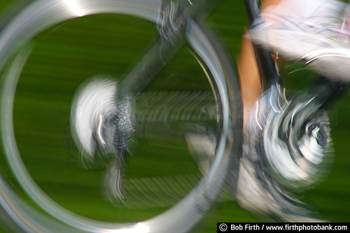 Bicycling;bicycle wheel;pedaling;pedaling action shot;pedaling motion;action shot;bicycle;bike;biking;blur;biker;cycling;cyclist;detail;fast;motion;road bike;wheel;wheel in motion;pedaling detail;pedaling close up;bicycle wheel in motion close up