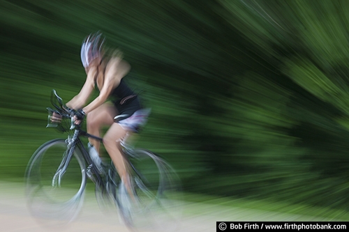 Bicycling;action shot;bicycle;bike;biker;biking;blur;cycling;cyclist;exercise;motion;pedaling;road bike;solo;sport;summer;woman;recreation;recreational