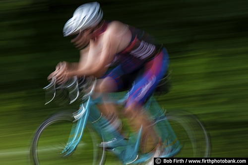 Bicycling;action shot;bicycle;bike;biker;biking;blur;close up;competition;cycling;cyclist;exercise;fast;man;motion;pedaling;pedaling action shot;pedaling motion;race;racing;road bike;road race;solo;speed;sport;summer