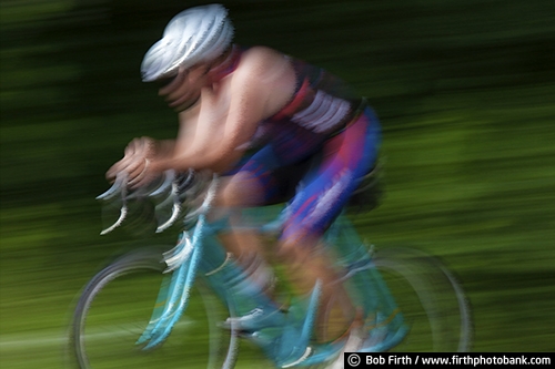 Bicycling;action shot;bicycle;bike;biker;biking;blur;close up;competition;cycling;cyclist;exercise;fast;man;motion;pedaling;pedaling action shot;pedaling motion;race;racing;road bike;road race;solo;speed;sport;summer;wind effect