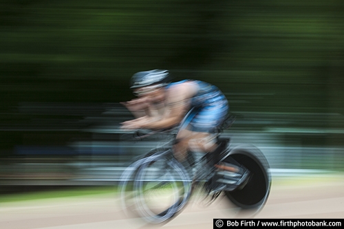 Bicycling;action shot;bike;biker;biking;blur;competition;cycling;cyclist;exercise;fast;man;motion;pedaling;pedaling action shot;pedaling motion;race;racing;road bike;road race;solo;speed;sport;summer