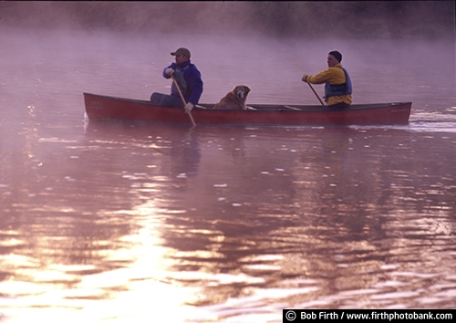 canoe;canoeing;companionship;dog;fog;foggy;fun pastime;lake;men;Minnesota;MN;paddle sport;peaceful;recreational;water sport;morning;sunrise