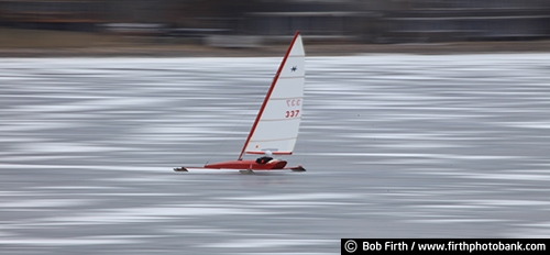 ice boating;ice boat;ice sailing;MN;Minnesota;winter sports;recreation;outdoors;outside;Lake Minnetonka;frozen lake;sail;action;fun pastime;motion photos;panning;speed