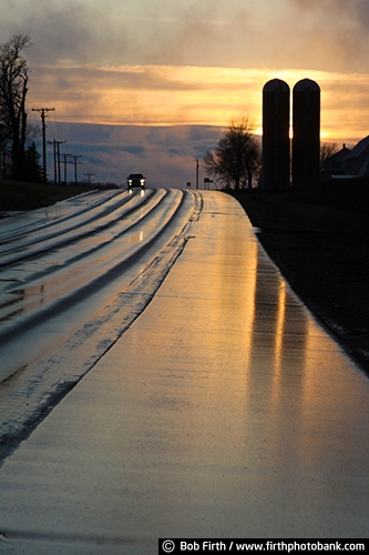 country;dusk;LaCrosse WI;rain;silhouette;silos;sunset;wet roads;Wisconsin;phone poles;evening