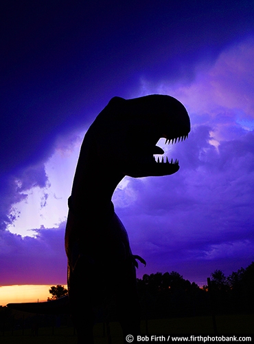 Signs;dinosaur;T Rex;dusk;evening;humor;signage;silhouette;statue;clouds;Minnesota;MN