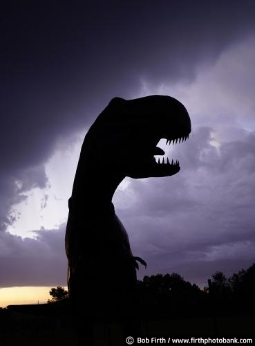 Signs;dinosaur;T Rex;dusk;evening;humor;signage;silhouette;statue;clouds;Minnesota;MN